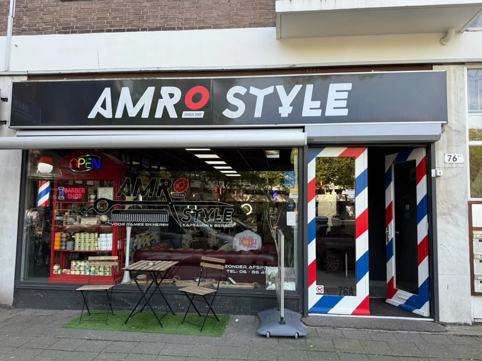 De winkelgevel en ingang van Amro Style aan de Peppelweg 76A